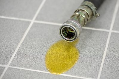 puddle of oil from hydraulic quick couplings puddle of oil from hydraulic quick couplings