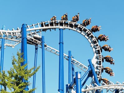 Upside down roller coaster fun ride at amusement park Gardland Upside down roller coaster fun ride at amusement park Gardland