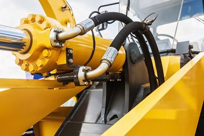 hydraulics tractor yellow. focus on the hydraulic pipes