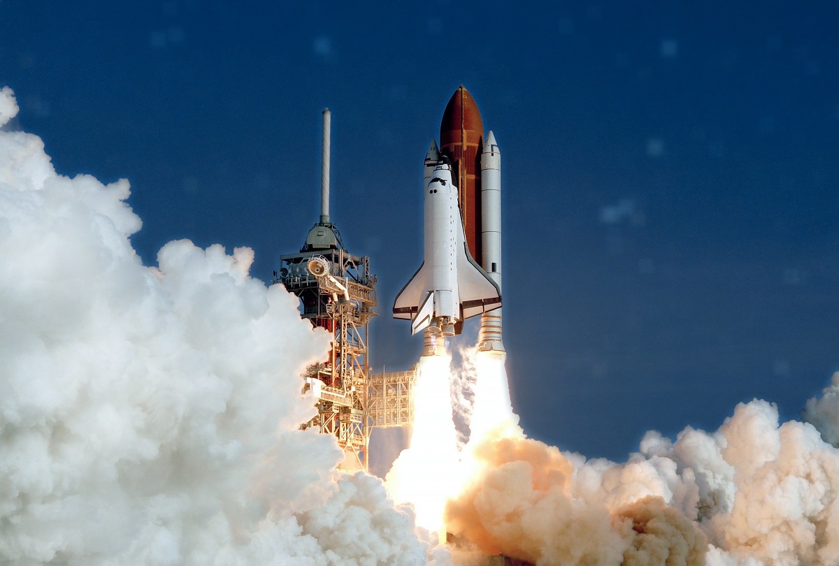 The launch of the space shuttle. With fire and smoke. The launch of the space shuttle. With fire and smoke.